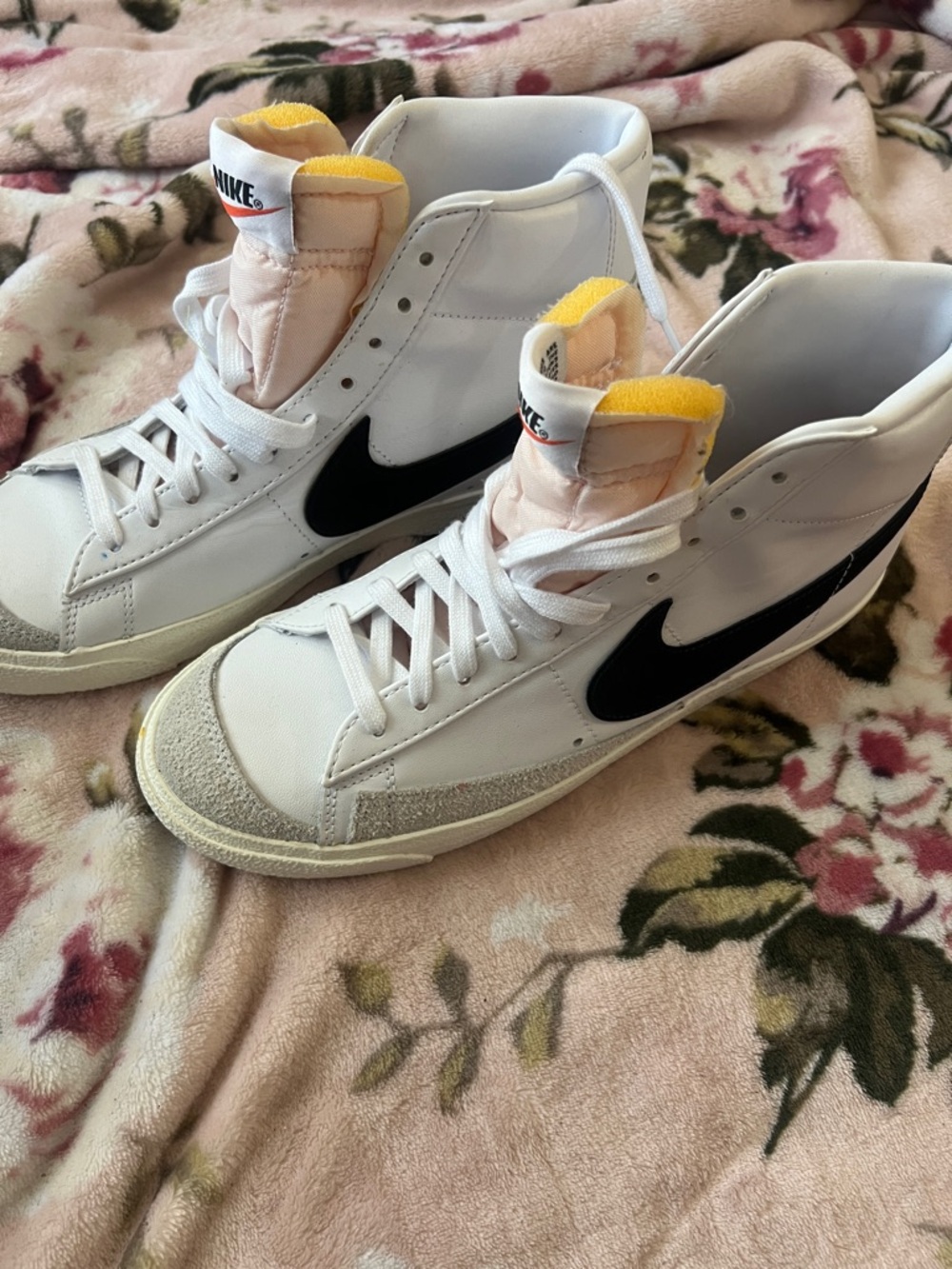 Nike White High-Top Sneakers with Black Swoosh and Yellow Tongue